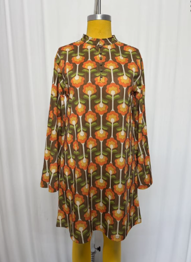 Lil Bee's Bohemian Cradle of Love Woman retro tulip dress in vibrant fabric, featuring a fitted waist and flared skirt.