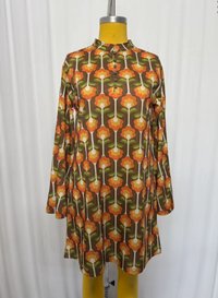 Lil Bee's Bohemian Cradle of Love Woman retro tulip dress in vibrant fabric, featuring a fitted waist and flared skirt.