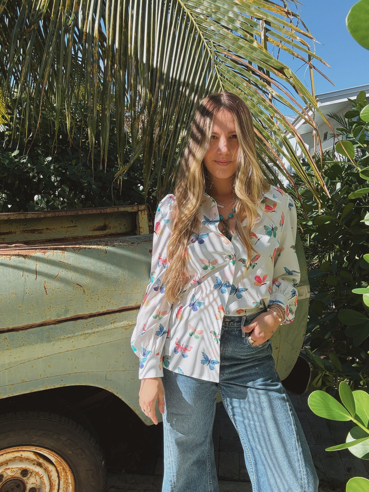 Lil Bee's Bohemian butterfly button-up blouse featuring eye-catching design, lightweight fabric, and stylish casual fit.