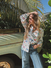 Lil Bee's Bohemian butterfly button-up blouse featuring eye-catching design, lightweight fabric, and stylish collar detail.