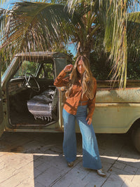 John Wayne Western pearl snap button-up top in brown by Lil Bee's Bohemian, featuring a classic Western style and pearl snap details.