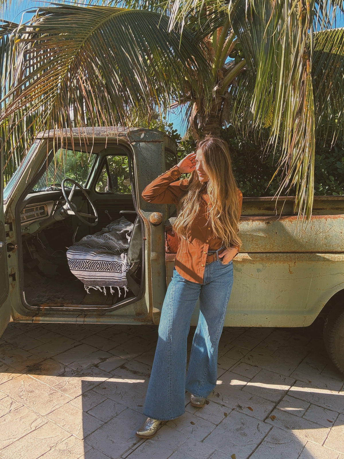 Brown John Wayne Western pearl snap button-up top by Lil Bee's Bohemian, featuring classic Western style and pearl snap details.
