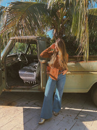 Brown John Wayne Western pearl snap button-up top by Lil Bee's Bohemian, featuring classic Western style and pearl snap details.