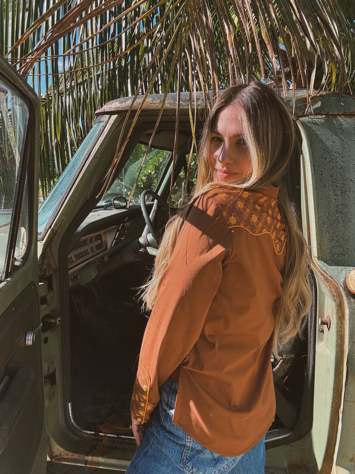 Brown John Wayne Western pearl snap button-up top by Lil Bee's Bohemian, made of soft fabric with classic Western style details.