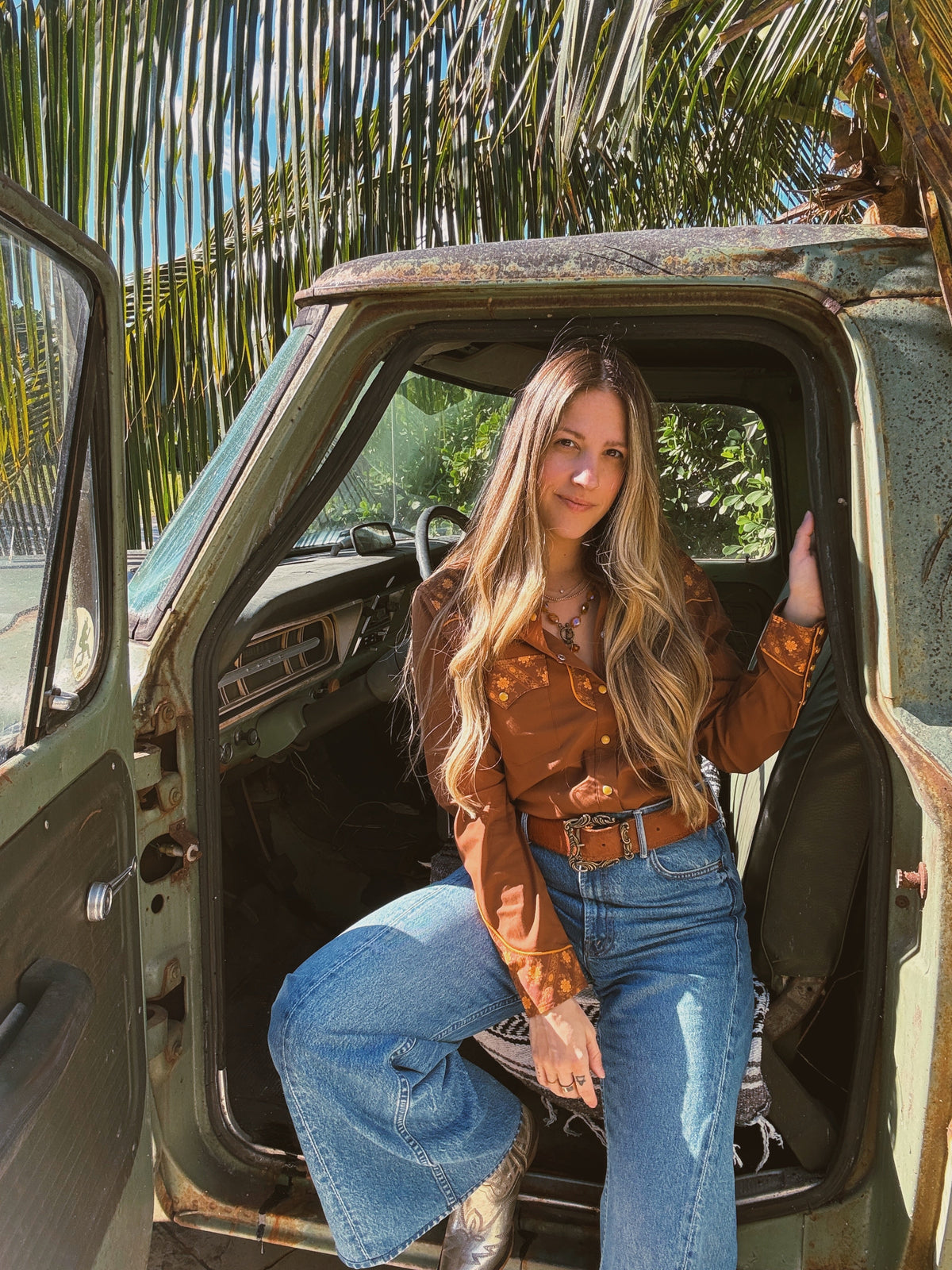 John Wayne Western pearl snap button-up top in brown from Lil Bee's Bohemian, showcasing the classic Western style and detailed stitching.
