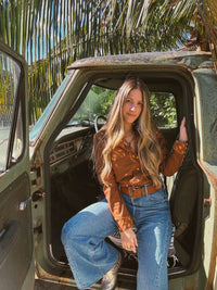 John Wayne Western pearl snap button-up top in brown from Lil Bee's Bohemian, showcasing the classic Western style and detailed stitching.