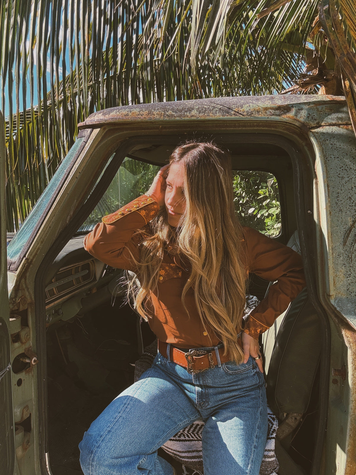 Brown John Wayne Western pearl snap button-up top by Lil Bee's Bohemian, featuring classic Western style and pearl snap details.