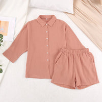 Women's cotton pajama set by Loran featuring a casual collar and relaxed sleepwear style, displayed in a comfortable, cozy fit.