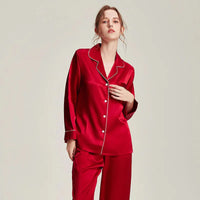 Loran women's white silk pajama set with long sleeve top and matching pants, elegant and comfortable nightwear.