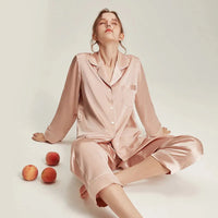 Loran women's long sleeve white silk pajama set, soft and elegant nightwear with comfortable fit and smooth fabric.