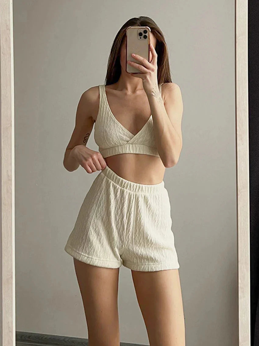 Loran women's 3-piece V-neck pajama set for sleepwear, featuring a comfortable top, pants, and matching shorts, in soft fabric.