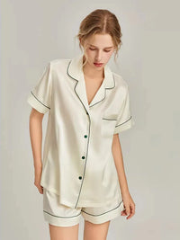 Women's pink silk pajamas set by Loran featuring short sleeve sleepwear made from real silk, comfortable and elegant sleep attire.