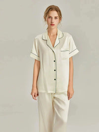 Women's pink silk pajamas set by Loran featuring short sleeves and smooth real silk fabric for comfortable sleepwear.