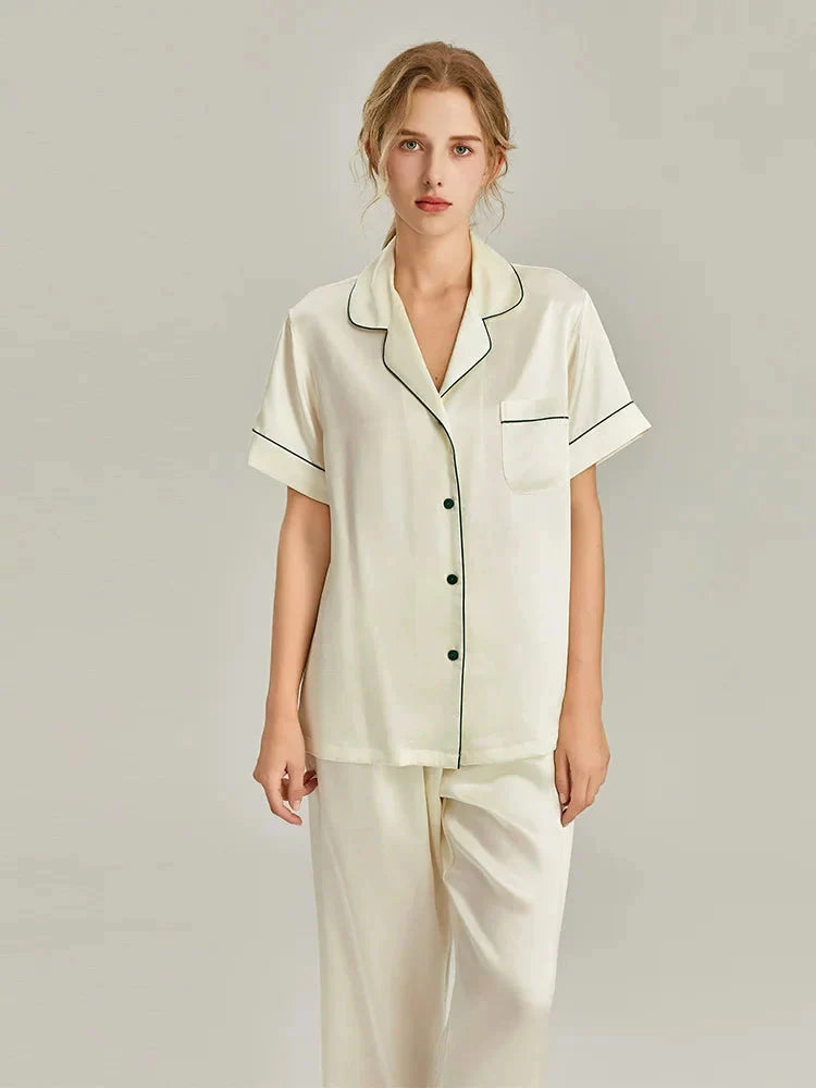Women's pink silk pajamas set by Loran featuring short sleeves and smooth real silk fabric for comfortable sleepwear.