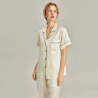 Women's pink silk pajama set by Loran, short sleeve sleepwear with real silk fabric, comfortable and elegant for nighttime wear.