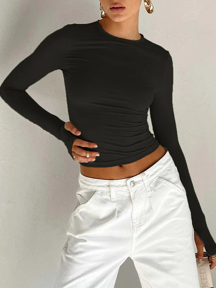 LORNEA women's long sleeve crew neck crop top with thumb holes, solid slim fit design, suitable for summer streetwear style.