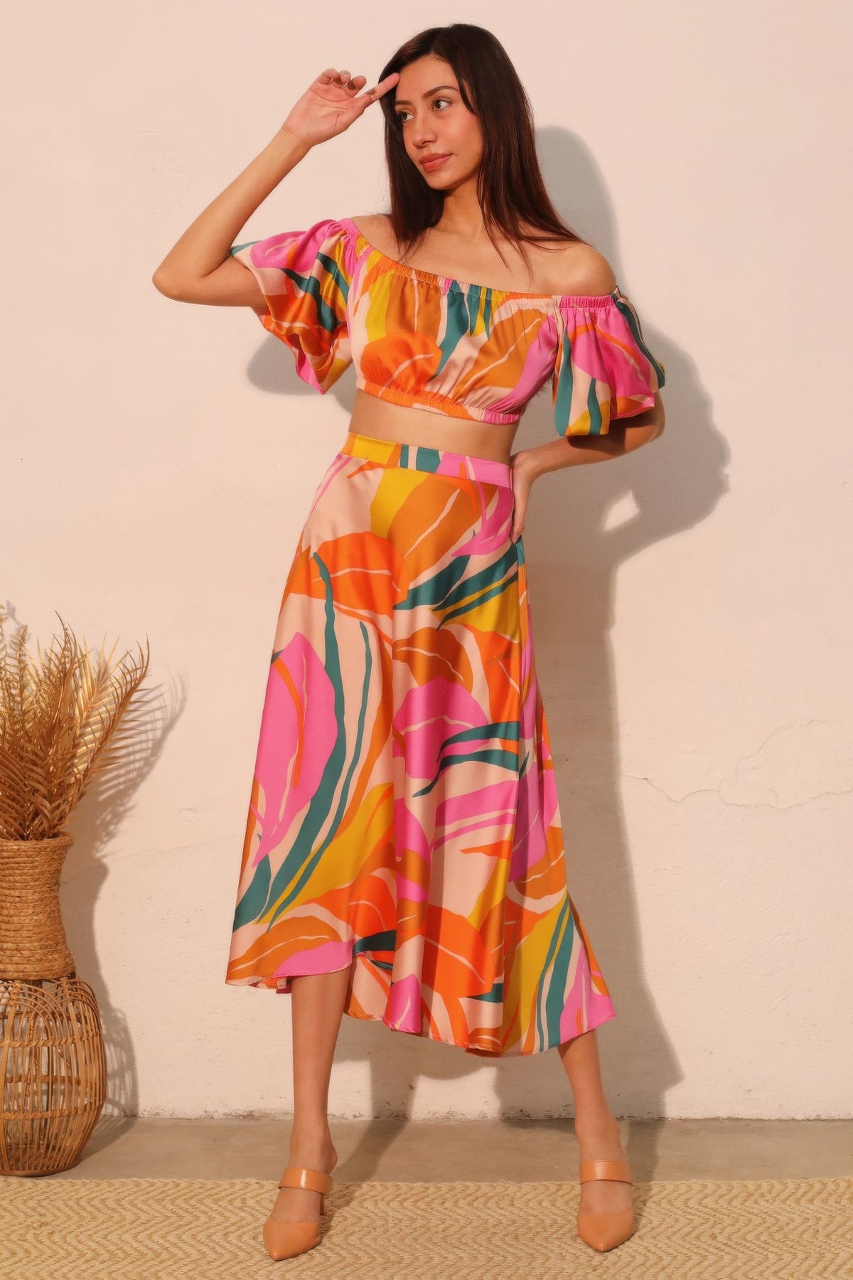 LORNEA Isla Tropical satin bubble sleeve crop top in vibrant tropical print with puffed sleeves and cropped fit.