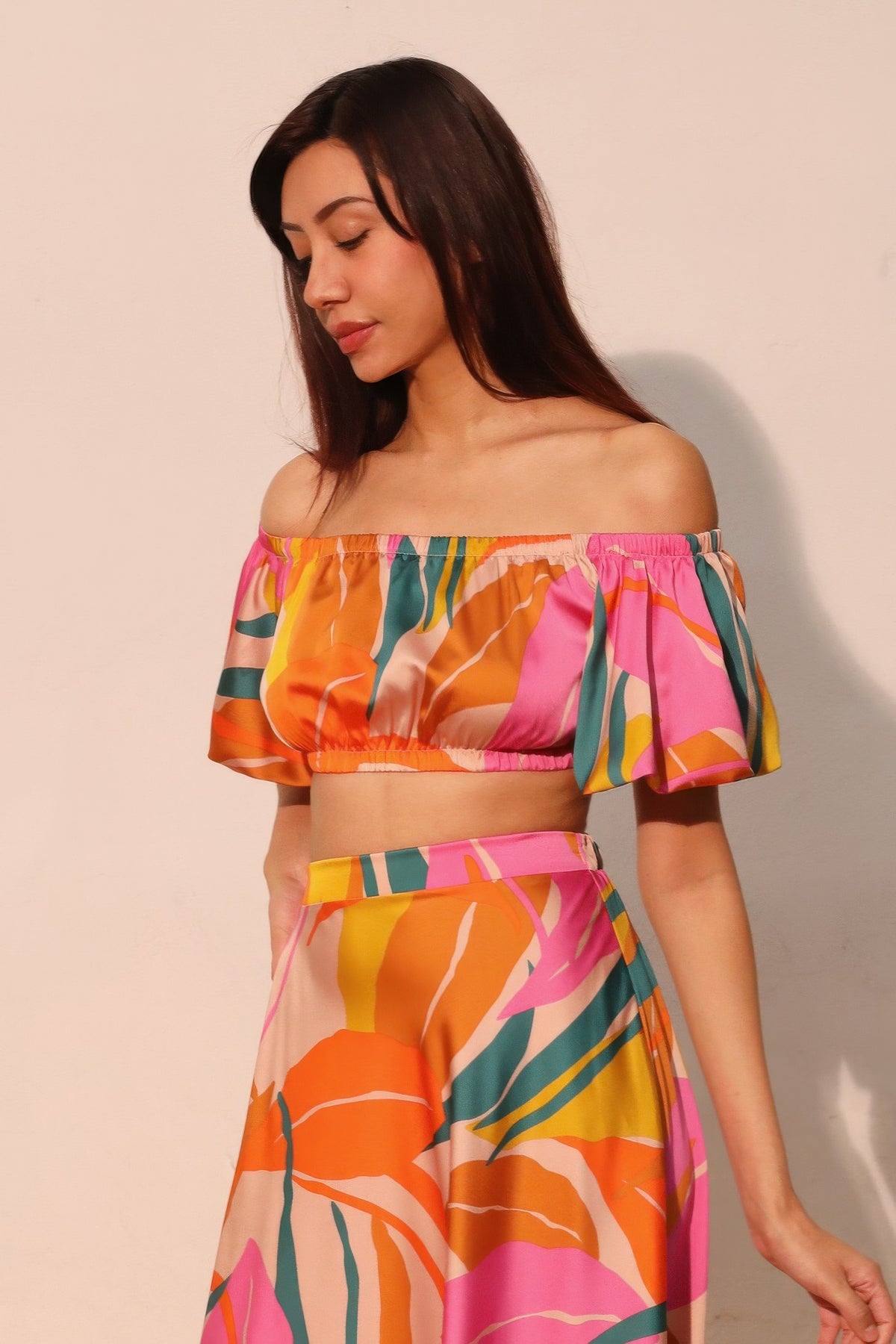 LORNEA Isla Tropical Satin Bubble Sleeve Crop Top, vibrant tropical print, satin fabric, and stylish bubble sleeves.