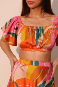 LORNEA Isla Tropical Satin Bubble Sleeve Crop Top in vibrant tropical print, featuring puffed satin bubble sleeves.