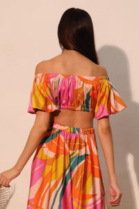 LORNEA Isla Tropical satin bubble sleeve crop top in vibrant tropical print, featuring puffed sleeves and a fitted design.
