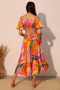 LORNEA Isla Tropical satin bubble sleeve crop top in vibrant tropical print, featuring satin fabric and stylish bubble sleeves.