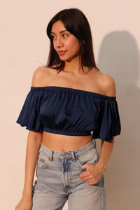 LORNEA washed poly silk bubble sleeve crop top in pastel color, featuring a fitted silhouette and stylish short sleeves.