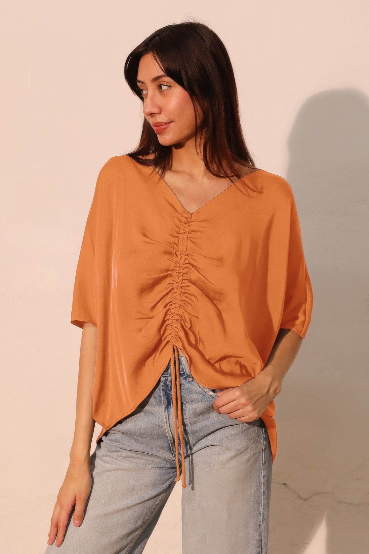 LORNEA washed poly silk drawstring dolman top in a relaxed fit, featuring soft fabric and stylish design.