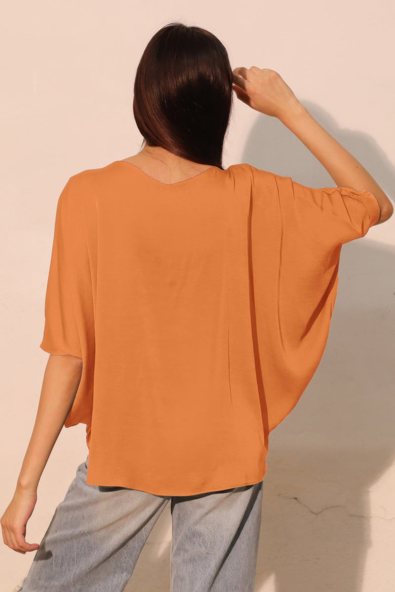 LORNEA washed poly silk drawstring dolman top in soft, draped fabric with relaxed fit and billowy sleeves.