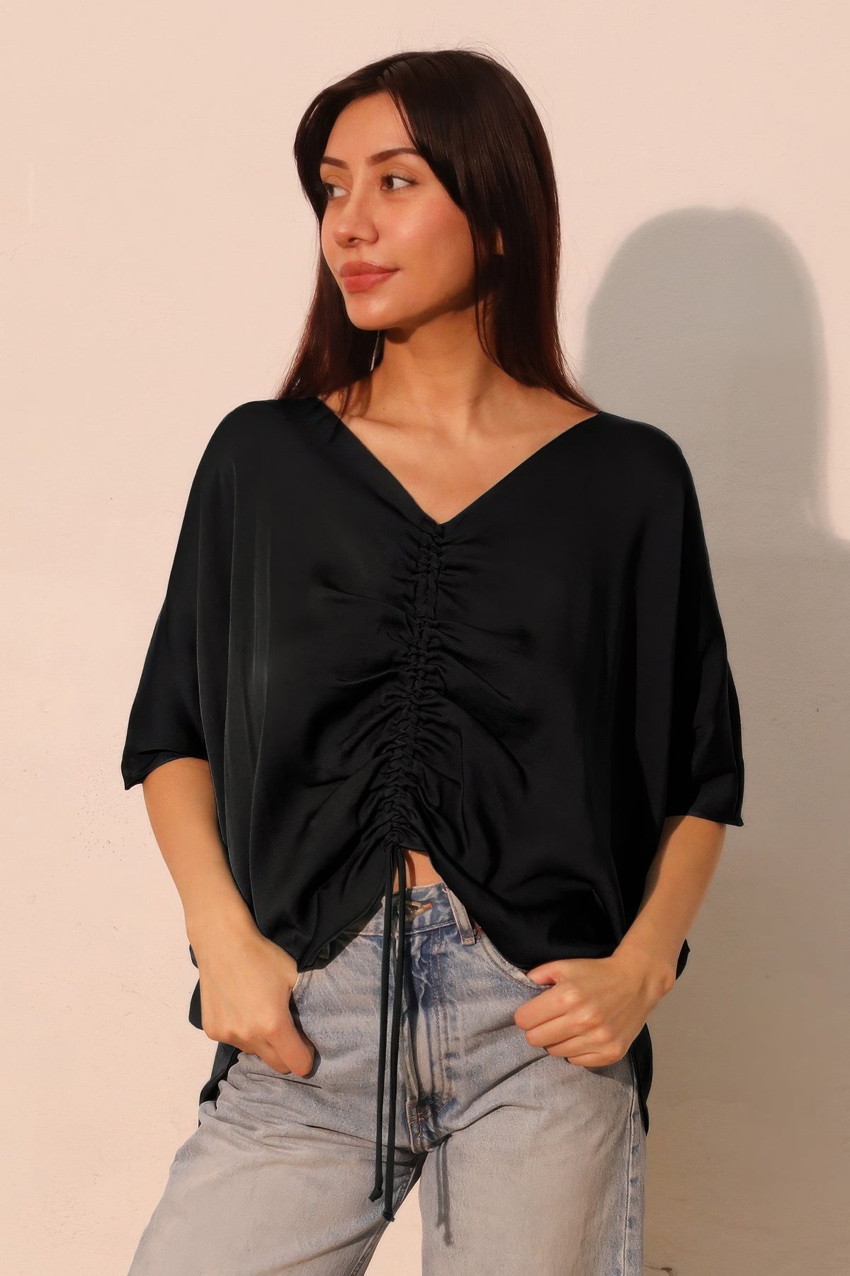 LORNEA washed poly silk drawstring dolman top in soft fabric with relaxed fit and long sleeves, shown in a stylish casual look.