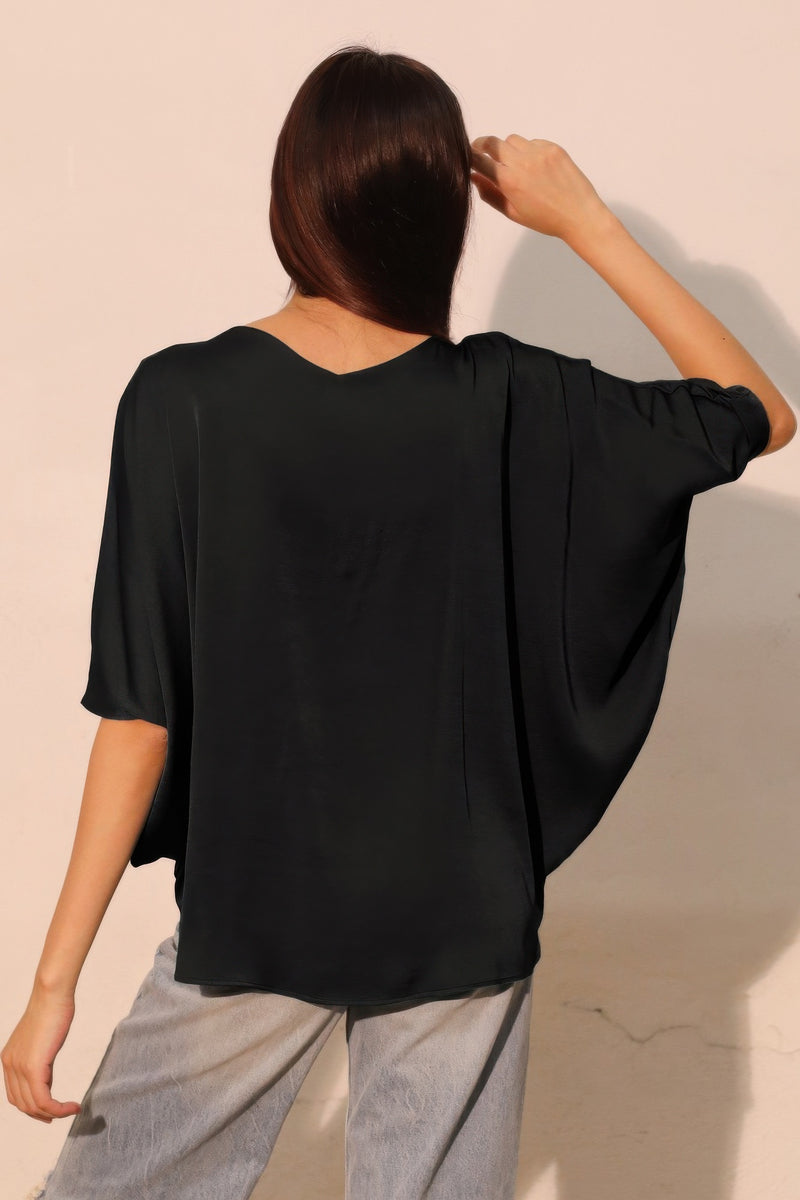 Washed poly silk drawstring dolman top by LORNEA featuring a relaxed fit and soft, silky fabric with a drawstring neckline.