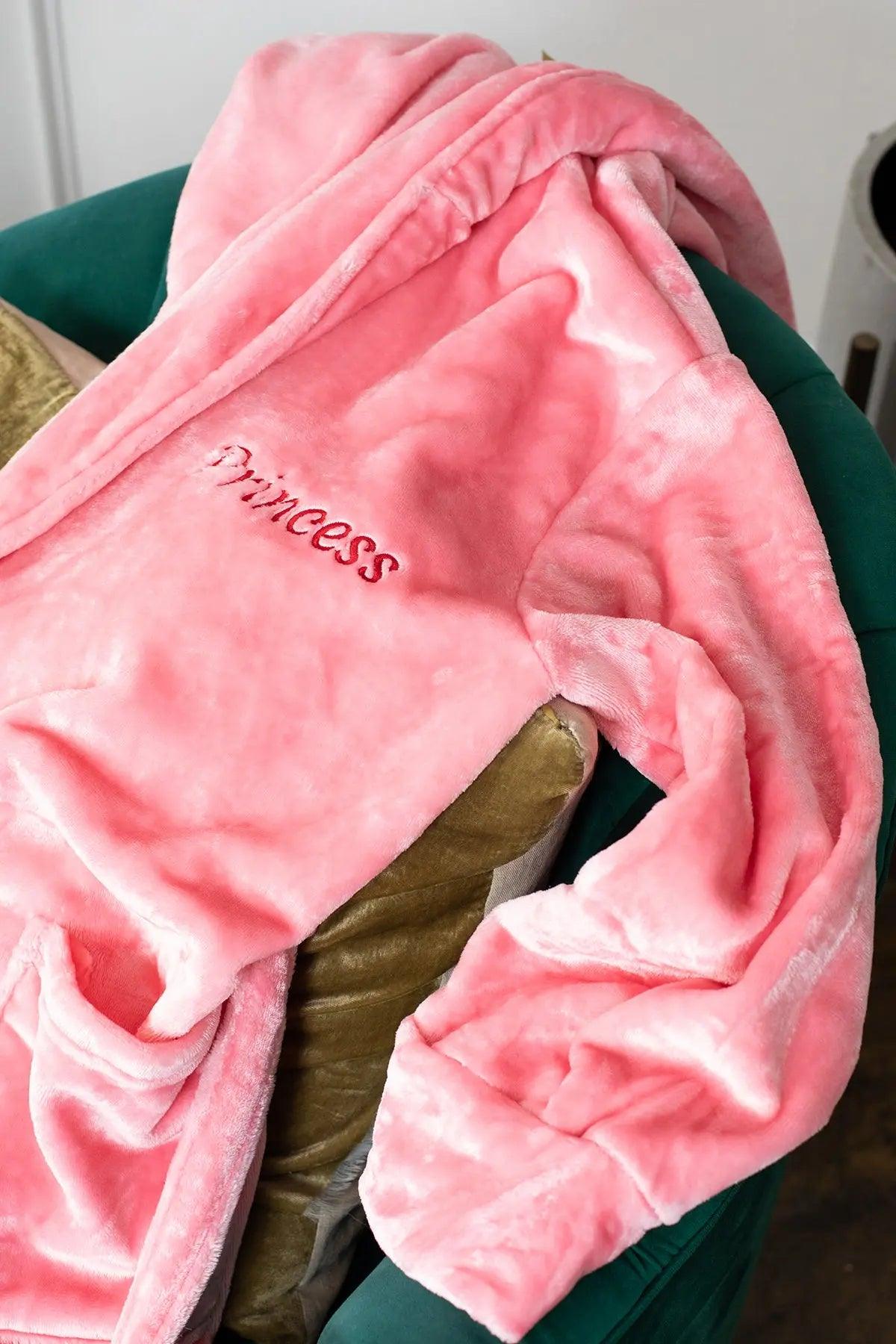Women’s plush hooded robe by Lotus Linen, soft grey fleece with a cozy hood, perfect for spa-like comfort at home.
