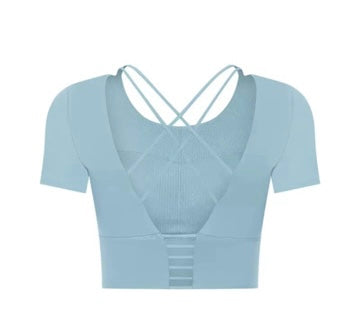 Small Manō Wear Haukea short sleeve top with a vibrant, tropical print on lightweight fabric, perfect for casual wear.
