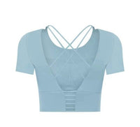 Small Manō Wear Haukea short sleeve top with a vibrant, tropical print on lightweight fabric, perfect for casual wear.