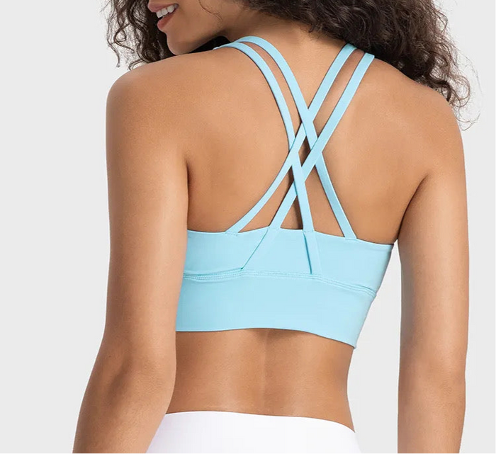 Manō Wear Pele sports bra in black, featuring a supportive fit and stylish design for active wear.