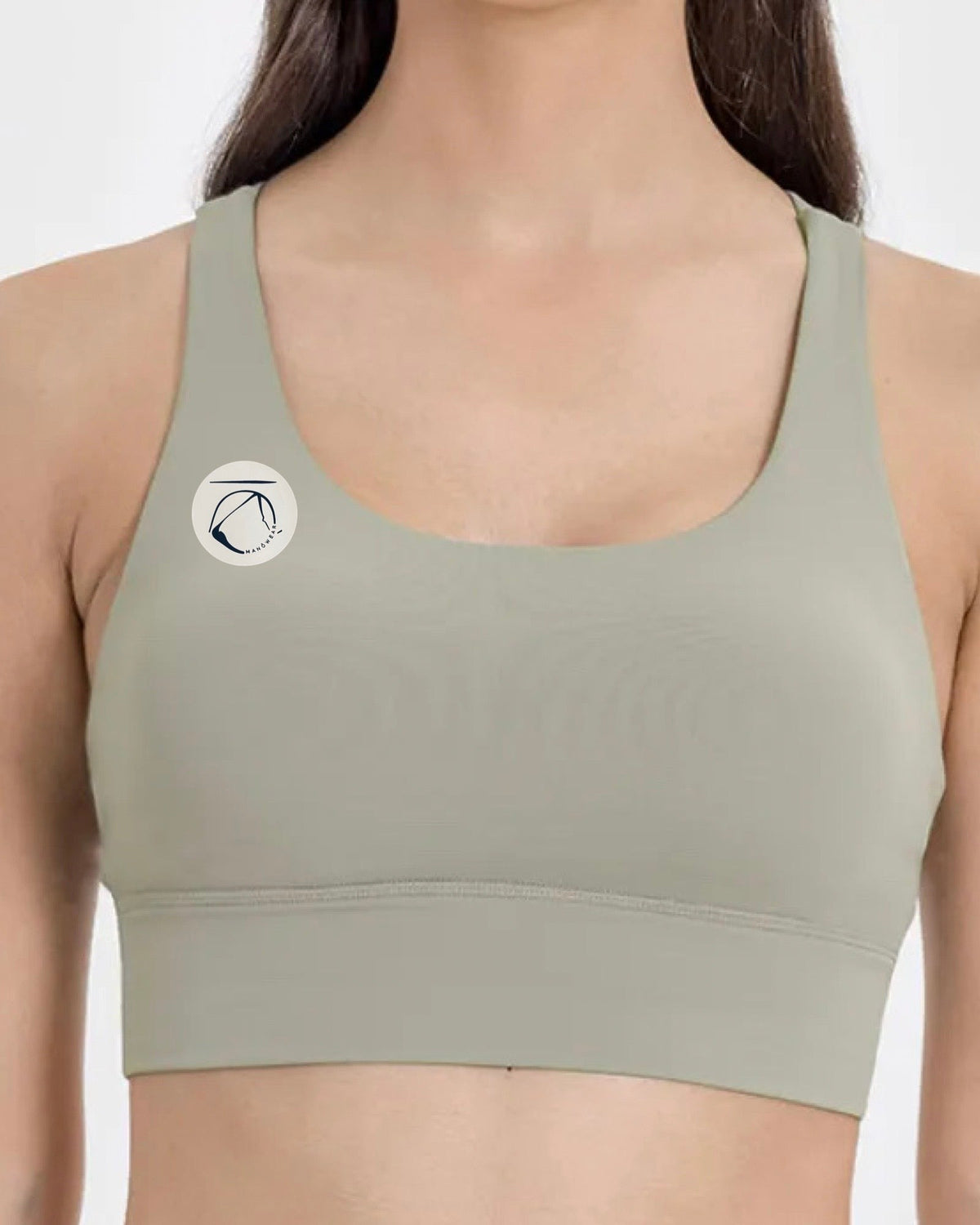 Manō Wear Pele sports bra in black with supportive design and logo, suitable for workout and active wear.