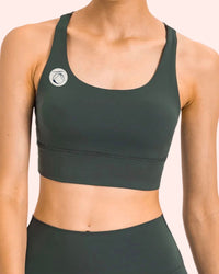 Manō Wear Pele sports bra in black featuring supportive design, ideal for workout and active wear.