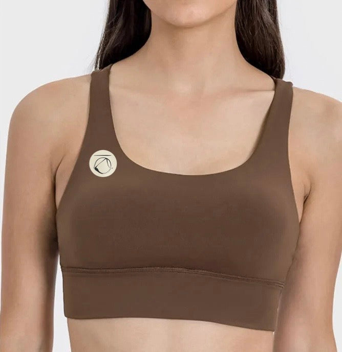 Manō Wear Pele sports bra in black, featuring supportive design and adjustable straps, ideal for activewear and workouts.