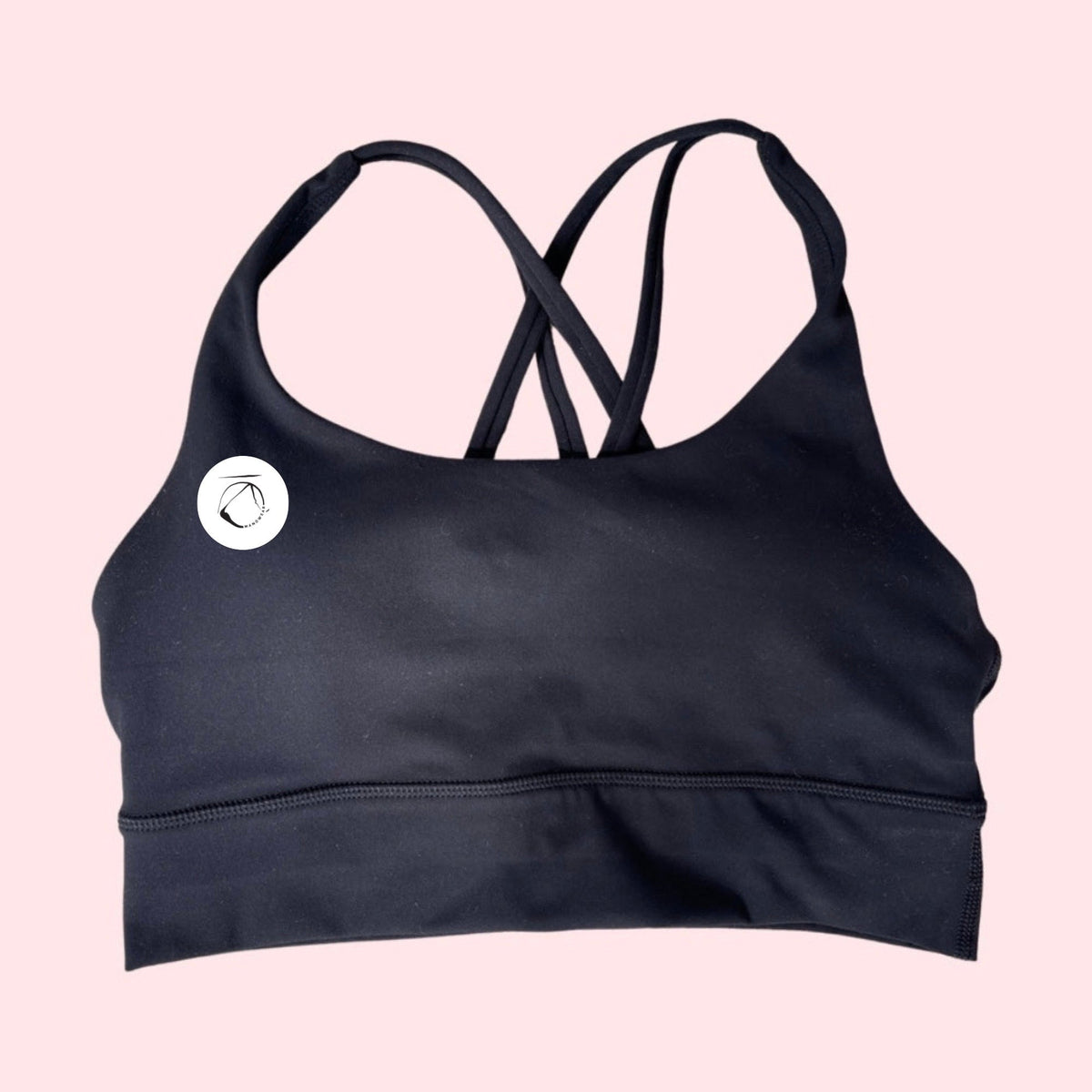 Manō Wear Pele sports bra in black, featuring supportive design and moisture-wicking fabric for active workouts.