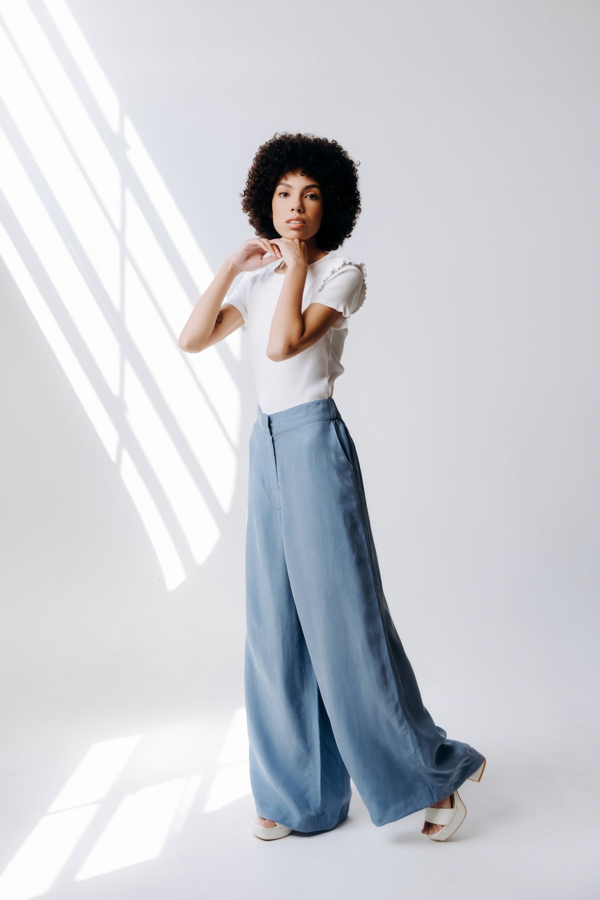 Margo Paige washable silk wide-leg pants displayed flat, showing smooth fabric, high waist, and flowing silhouette.