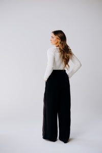 Margo Paige washable silk wide-leg pants shown in a relaxed fit, featuring flowing fabric and a comfortable high-waist design.