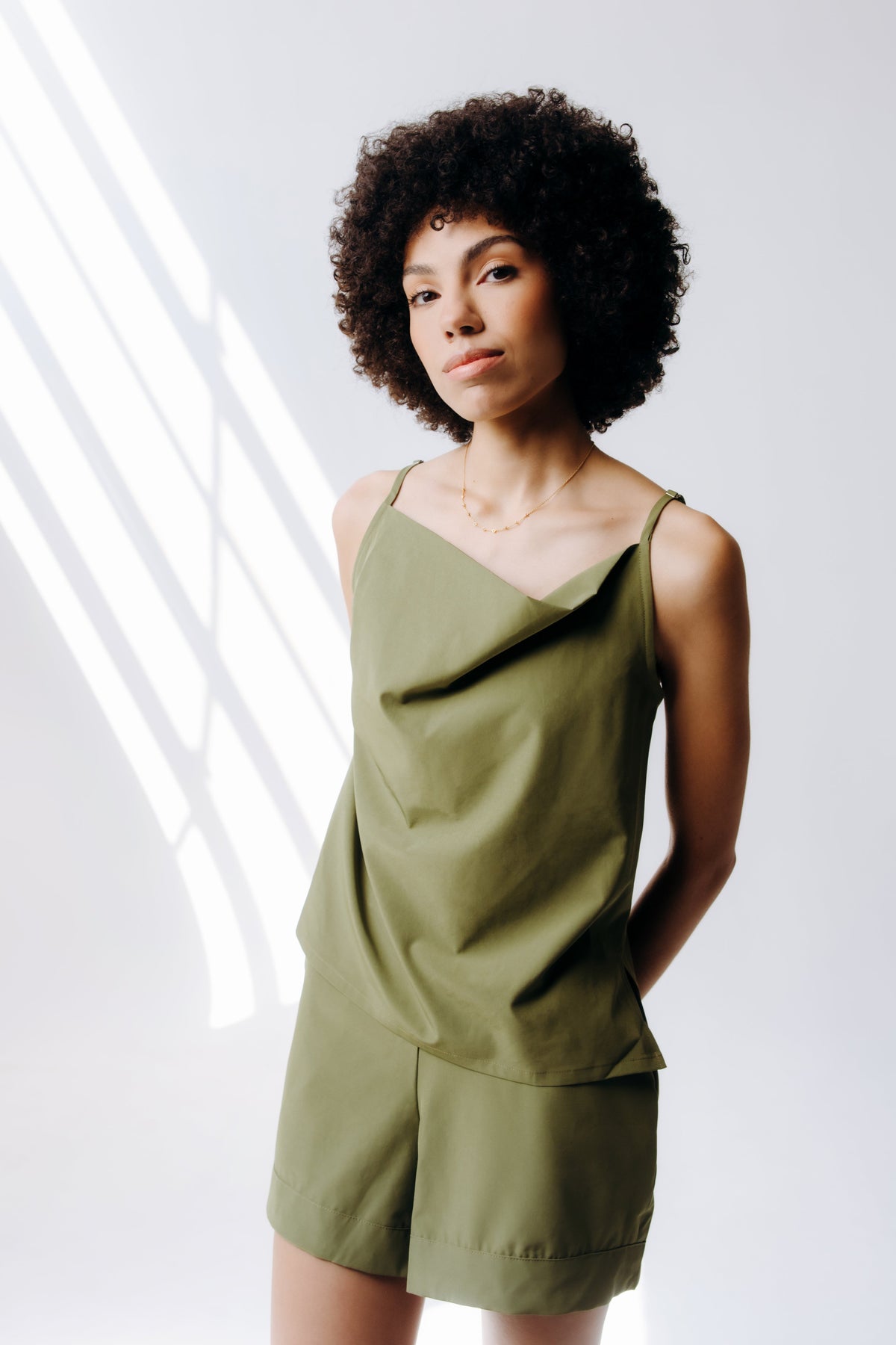 Margo Paige cowl neck camisole in soft fabric, featuring a stylish draped neckline and sleeveless design.