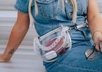 Margo Paige clear belt handbag with adjustable strap, transparent design, and spacious interior for versatile style and convenience.