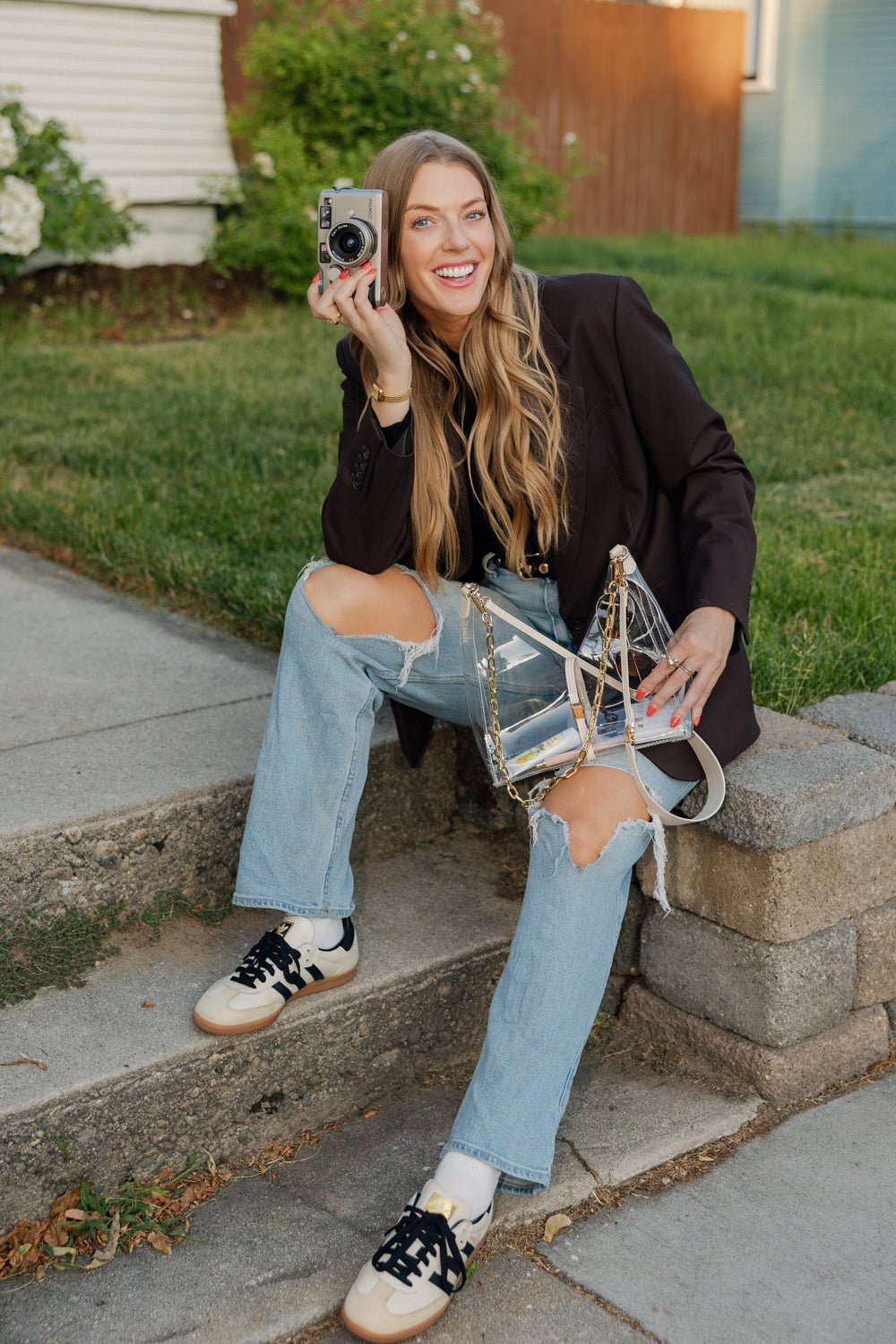 Taupe Margo Paige cut-out crossbody handbag with sleek design and adjustable strap, perfect for casual or chic outfits.
