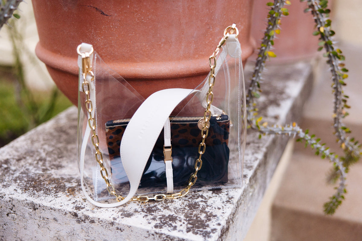 Taupe Margo Paige Cut-Out Crossbody handbag with stylish design and adjustable strap, ideal for casual or evening wear.