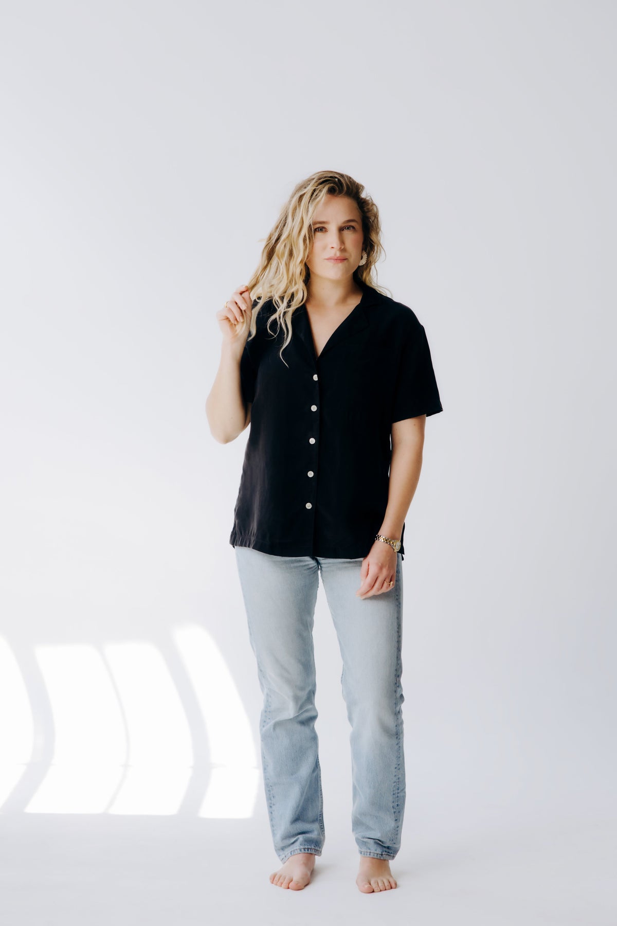 Margo Paige washable silk button-down shirt, lightweight and smooth fabric, shown laid flat with collar and long sleeves.