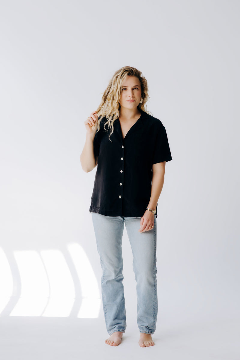 Margo Paige washable silk button-down shirt, lightweight and smooth fabric, shown laid flat with collar and long sleeves.