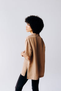 Margo Paige washable silk button-down shirt with long sleeves and classic collar, made from smooth, shiny silk fabric.
