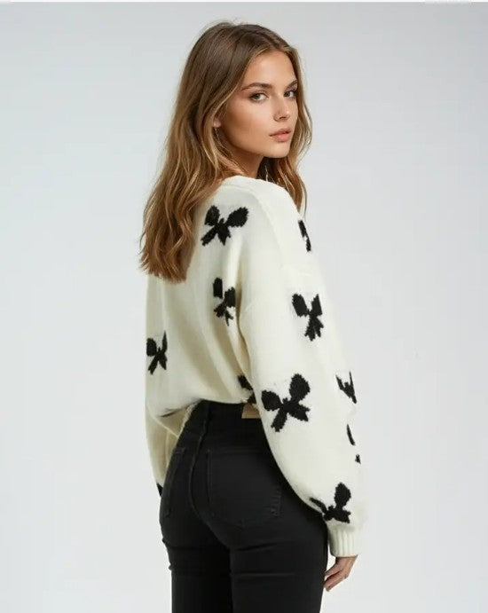 Miss Sparkling bow print tie-front cardigan showing a lightweight knit with bow and tie details in a stylish design.