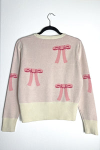 Miss Sparkling cropped knit bow cardigan featuring a soft knit fabric, front bow detail, and a stylish cropped fit.