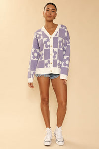 Checkered flower knit cardigan by Miss Sparkling featuring a colorful checkered pattern and floral knit design.